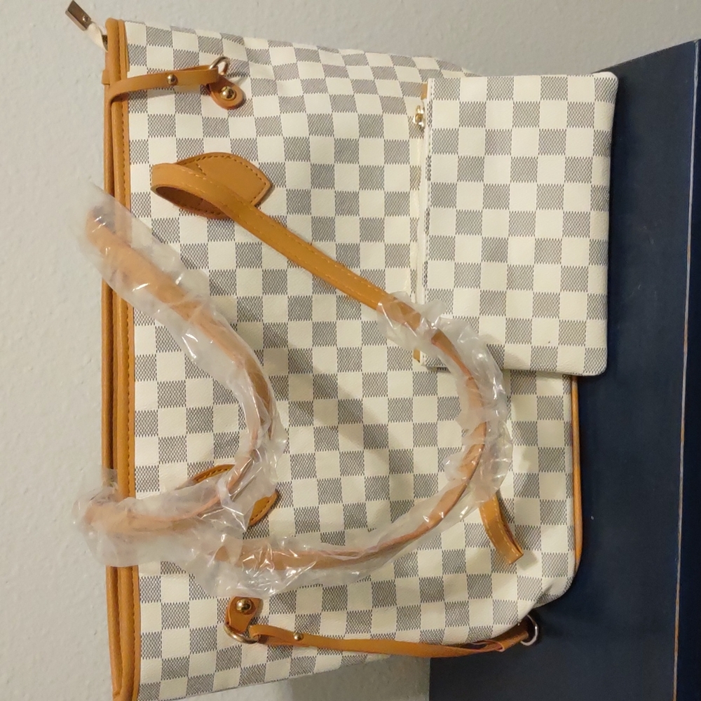 White and gray checkered handbag with small wristlet